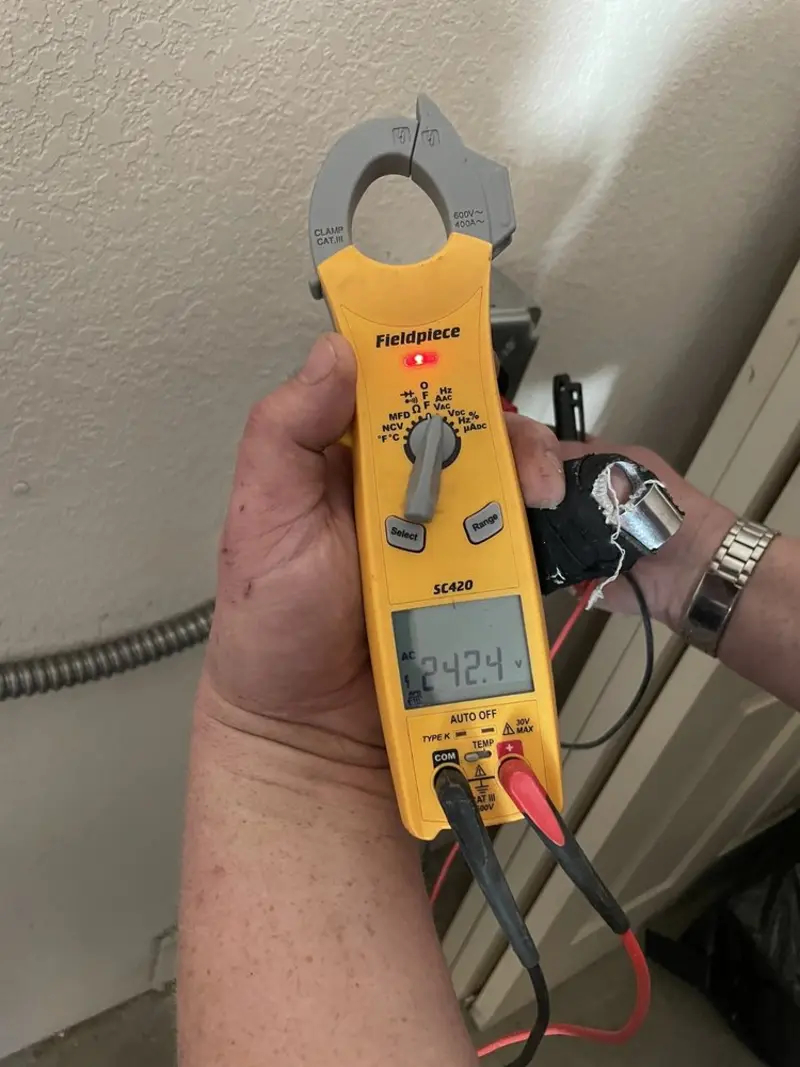 Voltage testing with clamp meter during Generator Installation in Westwood